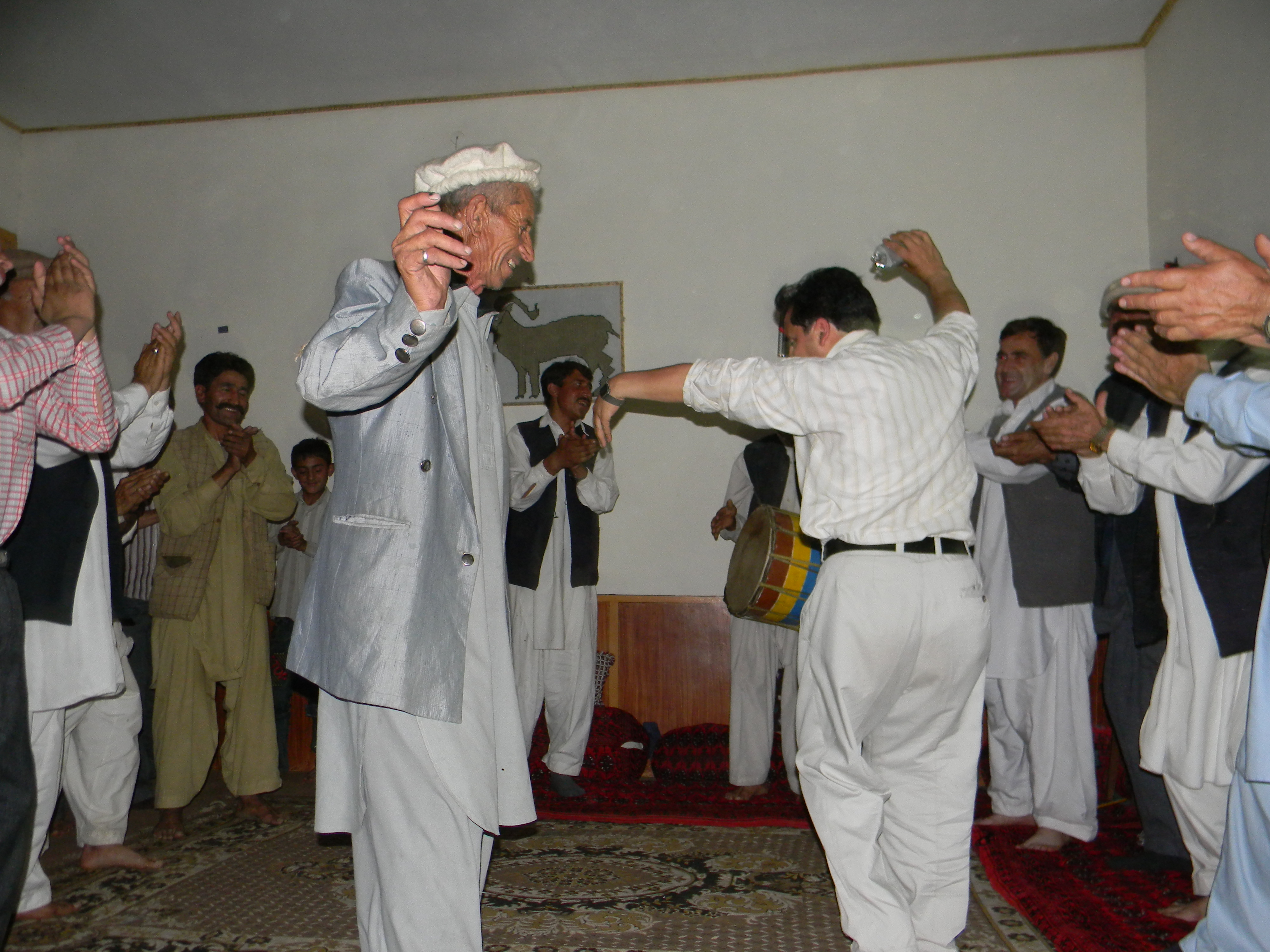 Hundur_men dancing during traditional music and song performance